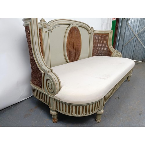 46 - A Continental two seater sofa, with a painted and canework frame, 146 cm wide