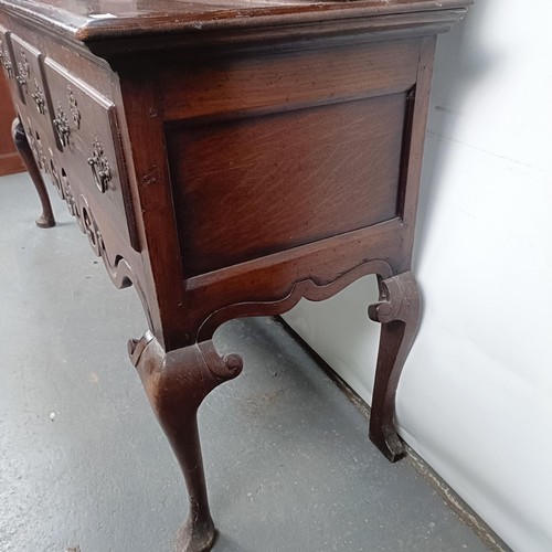 47 - An 18th century style oak dresser, the back fitted an 8 day clock (not shown), the base with three d... 