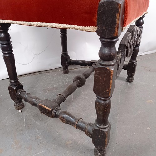 49 - An 19th century style oak armchair, with a carved back