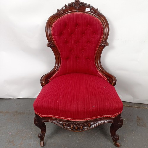 50 - A Victorian mahogany button back nursing chair