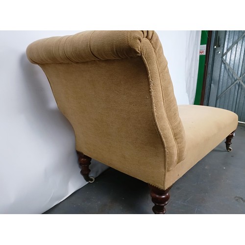 53 - A 19th century button back chaise longue, with mahogany legs to castors, 180 cm wide