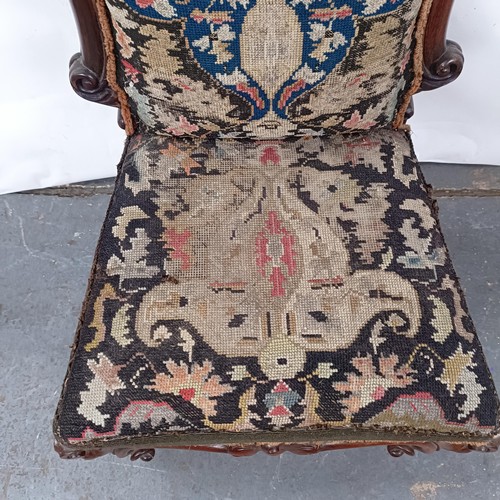 56 - A 19th century Continental mahogany framed nursing chair, with a tapestry back and seat