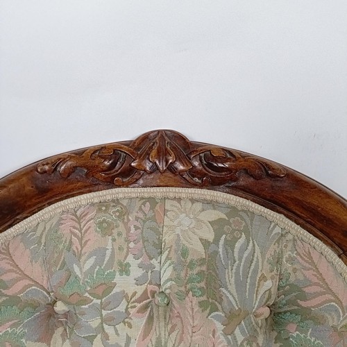 59 - A Victorian walnut framed button back nursing chair