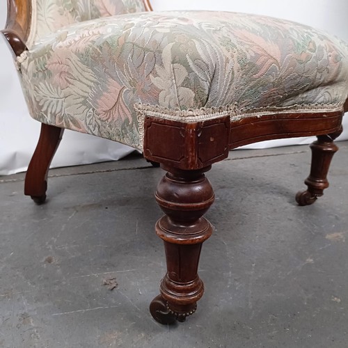 59 - A Victorian walnut framed button back nursing chair