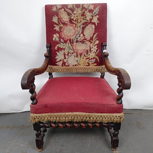 60 - An 19th century oak framed armchair, with a tapestry padded back