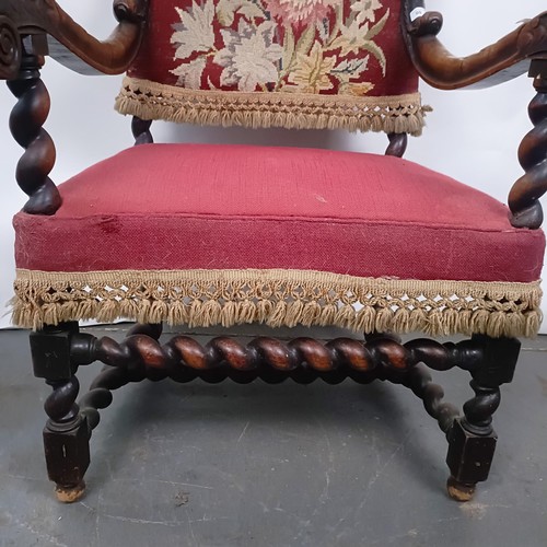 60 - An 19th century oak framed armchair, with a tapestry padded back