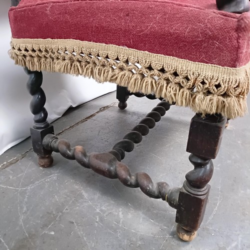 60 - An 19th century oak framed armchair, with a tapestry padded back