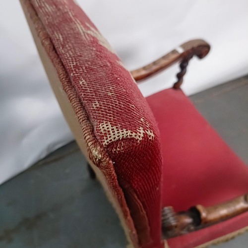 60 - An 19th century oak framed armchair, with a tapestry padded back