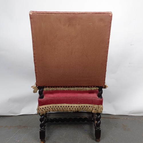 60 - An 19th century oak framed armchair, with a tapestry padded back