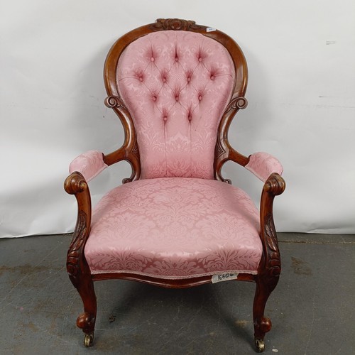 63 - A 19th century walnut framed button back armchair