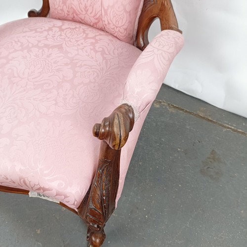 63 - A 19th century walnut framed button back armchair