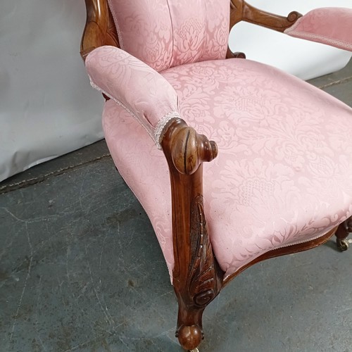 63 - A 19th century walnut framed button back armchair