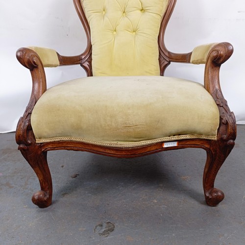 64 - A 19th century walnut framed button back armchair