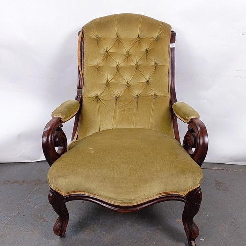 67 - A Victorian mahogany framed button back armchair