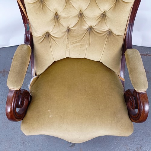 67 - A Victorian mahogany framed button back armchair