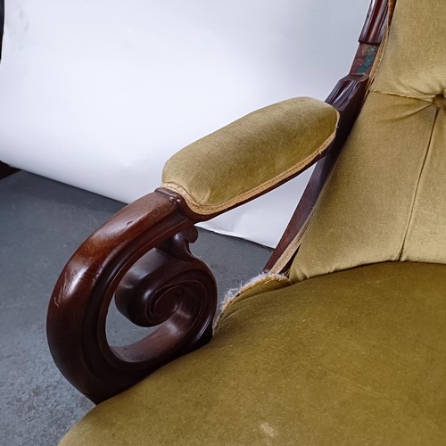 67 - A Victorian mahogany framed button back armchair