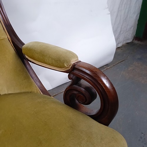 67 - A Victorian mahogany framed button back armchair