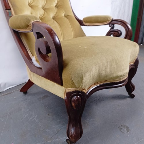 67 - A Victorian mahogany framed button back armchair