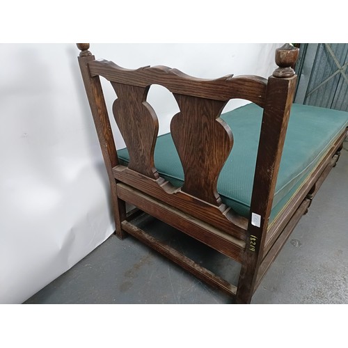 73 - An oak frame day bed, 200 cm wide