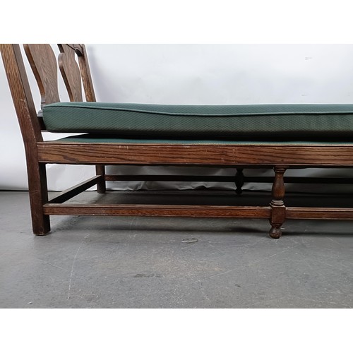 73 - An oak frame day bed, 200 cm wide