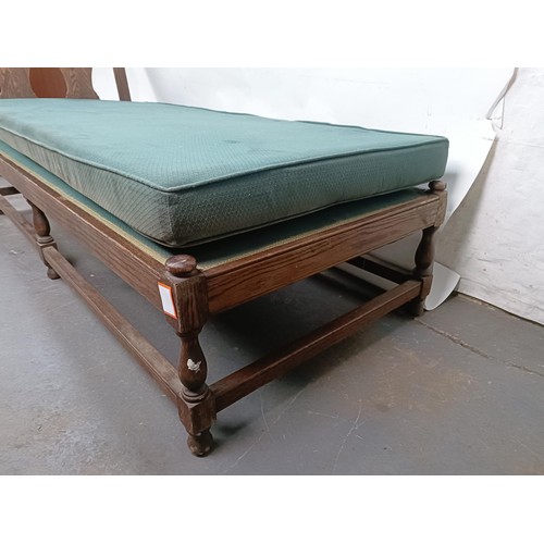 73 - An oak frame day bed, 200 cm wide