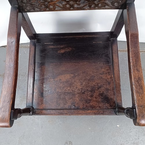 74 - An oak Wainscot type armchair, with a marquetry inlaid panel back