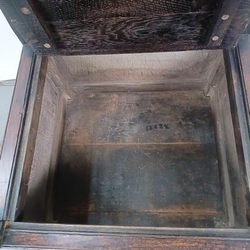 74 - An oak Wainscot type armchair, with a marquetry inlaid panel back