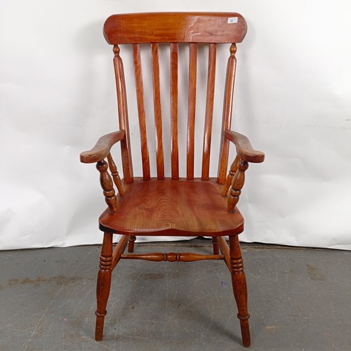 81 - A Victorian stained pine Windsor style armchair