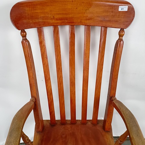 81 - A Victorian stained pine Windsor style armchair