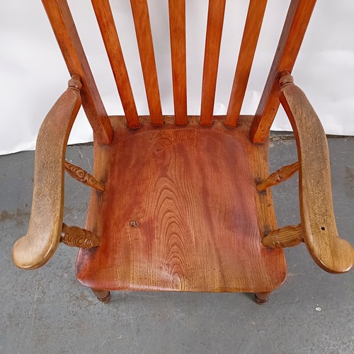 81 - A Victorian stained pine Windsor style armchair