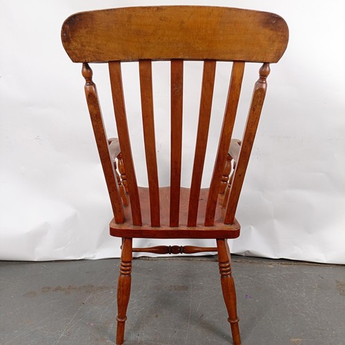 81 - A Victorian stained pine Windsor style armchair