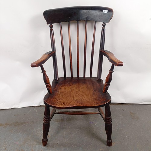 83 - A Victorian stained pine Windsor style armchair