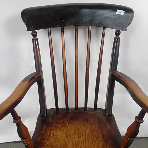 83 - A Victorian stained pine Windsor style armchair