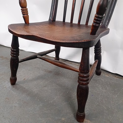 83 - A Victorian stained pine Windsor style armchair