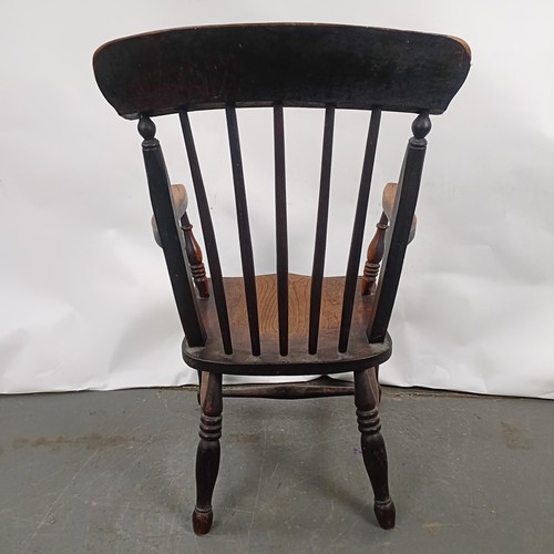 83 - A Victorian stained pine Windsor style armchair