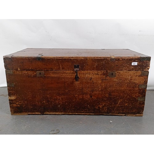 88 - A Victorian teak and brass bound trunk, 106 cm wide