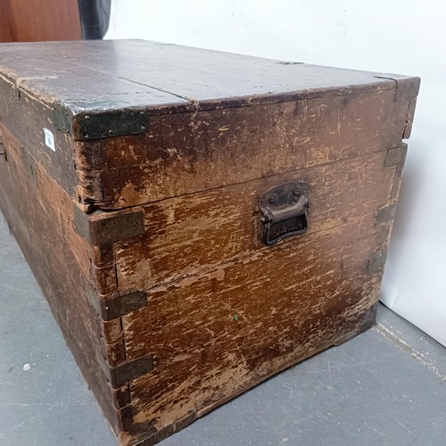 88 - A Victorian teak and brass bound trunk, 106 cm wide