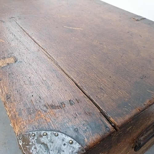 88 - A Victorian teak and brass bound trunk, 106 cm wide