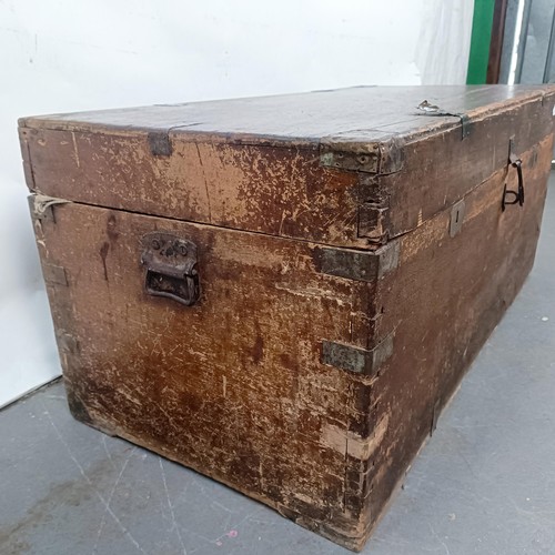 88 - A Victorian teak and brass bound trunk, 106 cm wide