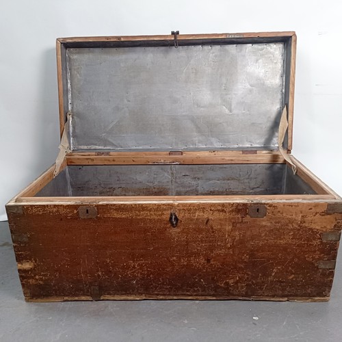 88 - A Victorian teak and brass bound trunk, 106 cm wide