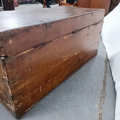 88 - A Victorian teak and brass bound trunk, 106 cm wide