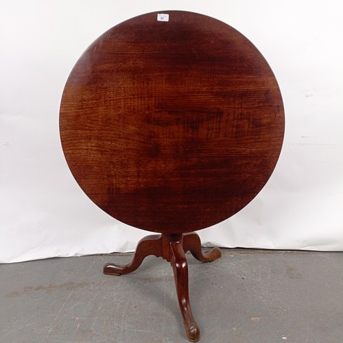 92 - A Victorian mahogany tilt top table, on a column support to a tripod base, 86 cm diameter