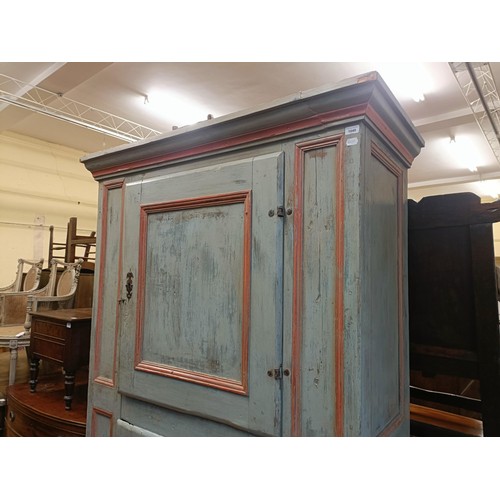 1040 - A Continental painted pantry cupboard, with two cupboard doors, 210 cm high x 135 cm wide