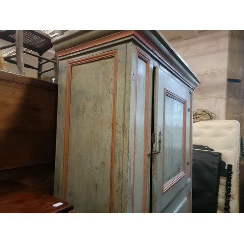 1040 - A Continental painted pantry cupboard, with two cupboard doors, 210 cm high x 135 cm wide