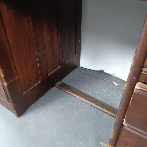 93 - An Edwardian oak roll top desk, 127 cm wide