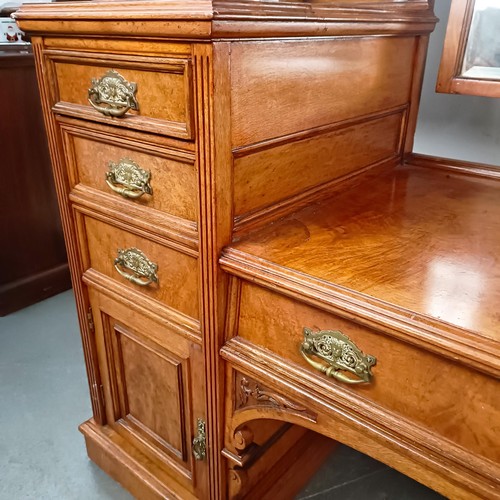 96 - A 19th century walnut kneehole dressing table, superstructure carved shell, fruit and dragons, on a ... 