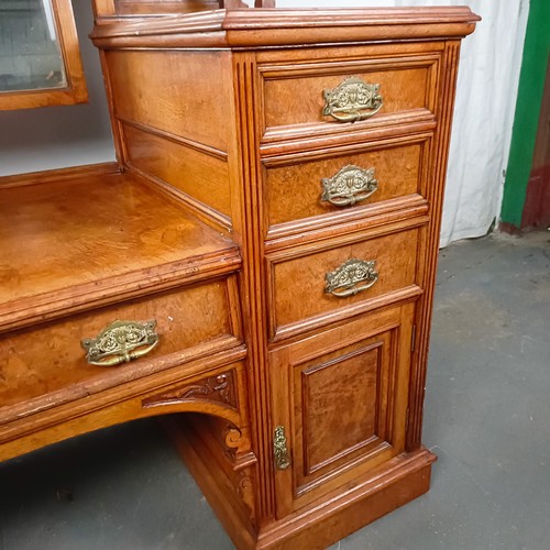 96 - A 19th century walnut kneehole dressing table, superstructure carved shell, fruit and dragons, on a ... 