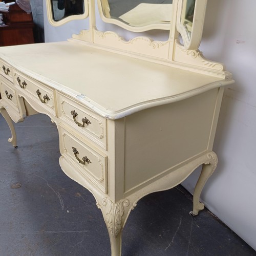 97 - A painted kneehole dressing table, 143 cm wide