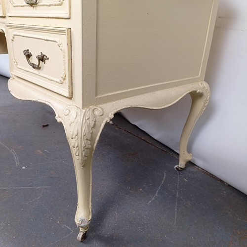 97 - A painted kneehole dressing table, 143 cm wide