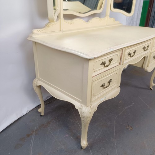 97 - A painted kneehole dressing table, 143 cm wide